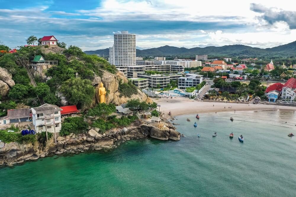best areas to stay - A view of Wat Khao Takiab hill and beach in Hua Hin Thailand